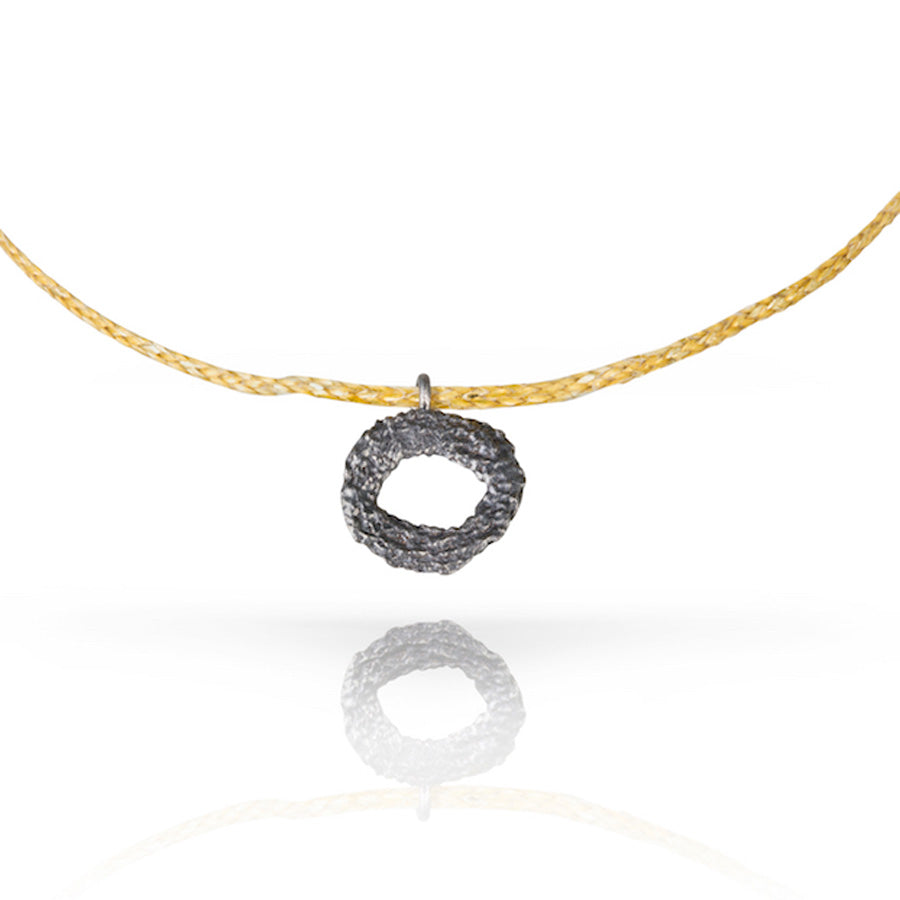 Mati-pendant_Black-Gold-Close-Up.jpg